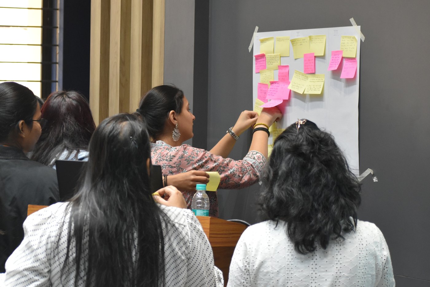 Course participants collaborating on an implementation-mapping exercise